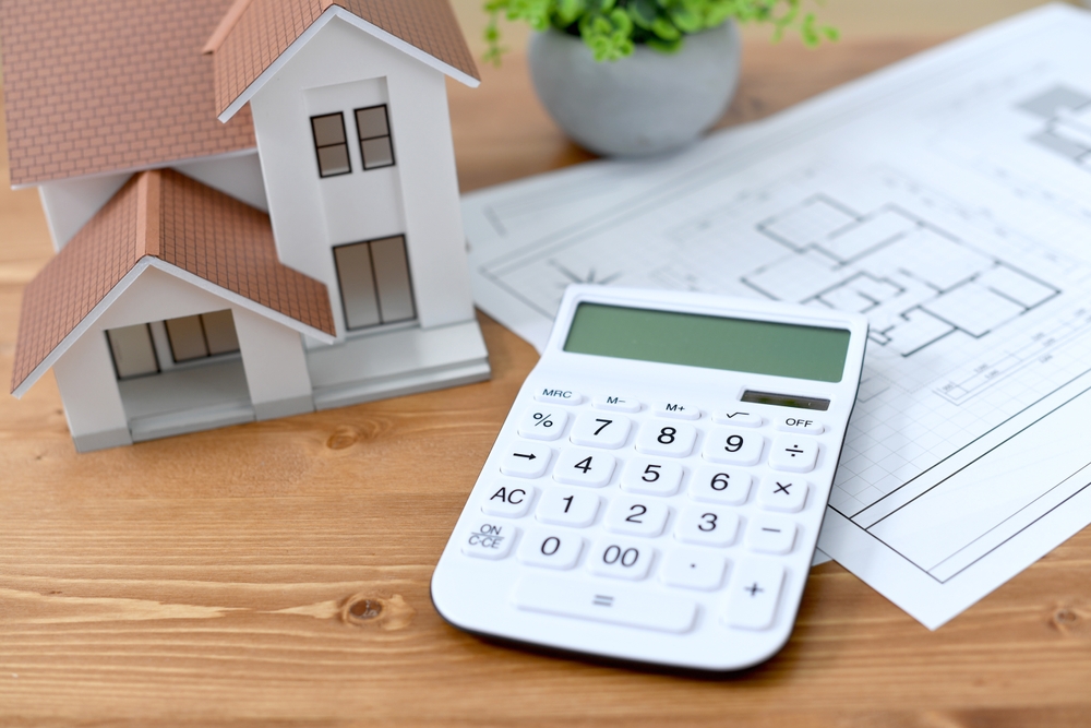Architectural,Model,Of,A,House,,House,Drawings,,And,Calculator