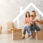 Happy,Family,With,Cardboard,Boxes,In,Their,New,House