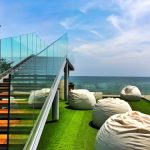 Wooden,Floor,Balcony,With,Clear,Glass,Handrail,Under,The,Sun,